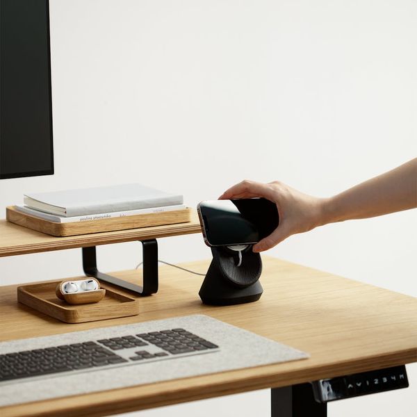 Minimalist laptop setup with warm desk lamp lighting